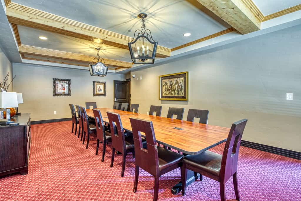 Boardroom with a long table and chairs along every side at BlueSky Breckenridge.