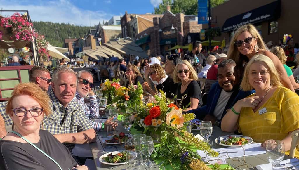 Savor the Summit attendees dining outdoors in Park City.