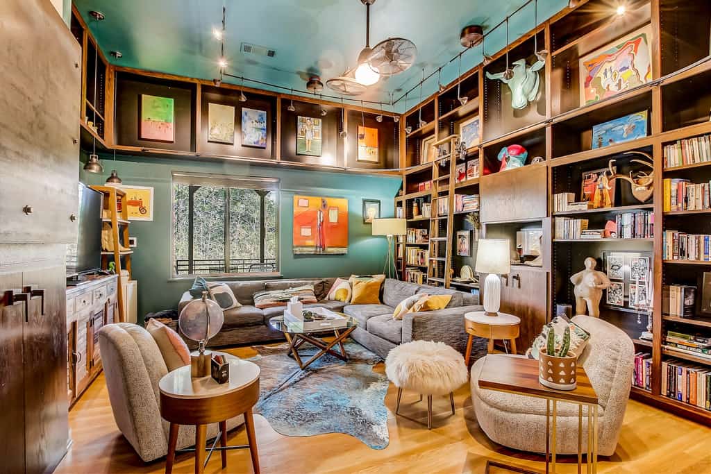 The living room lined with books at a unique vacation rental in Austin, TX.