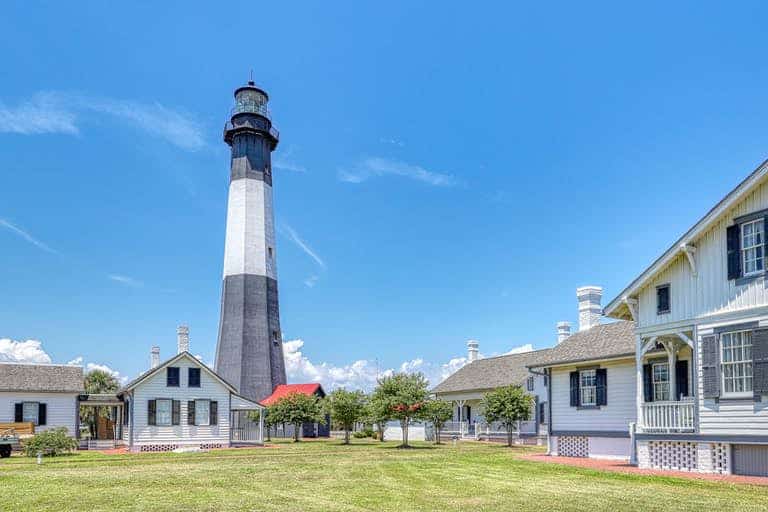 Black and white lighthouse on a sunny day in Tybee Island, GA.