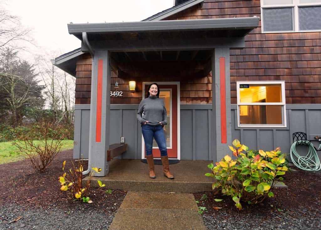 homeowner danielle stands outside of her vacation home