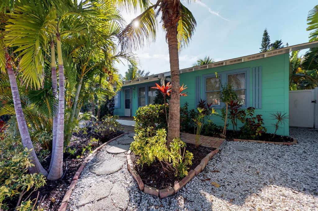 palm trees out front of the Sea Palm Cottage on anna maria island