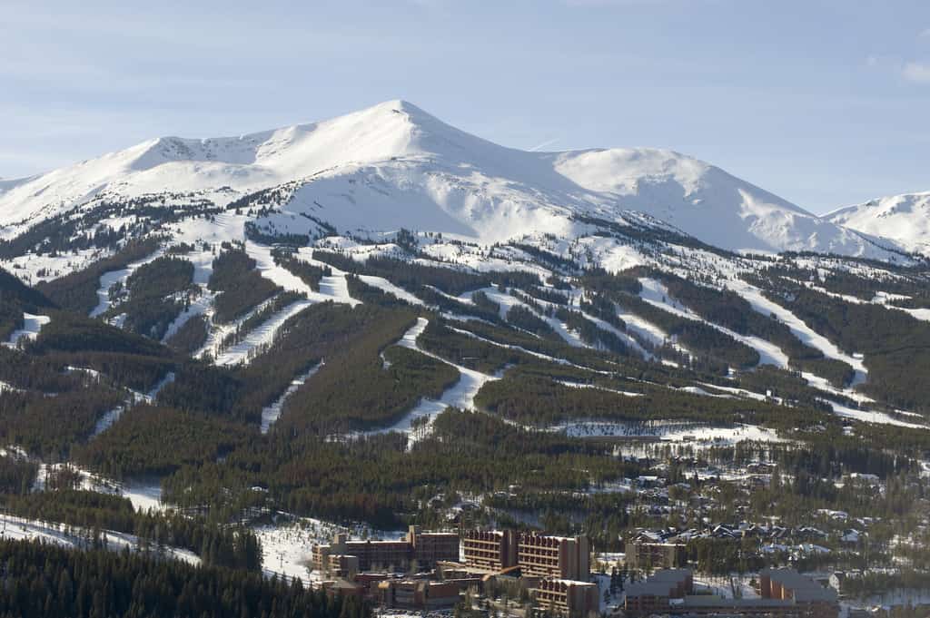 Large snowy mountains and a town at bottom in Breckenridge, CO.