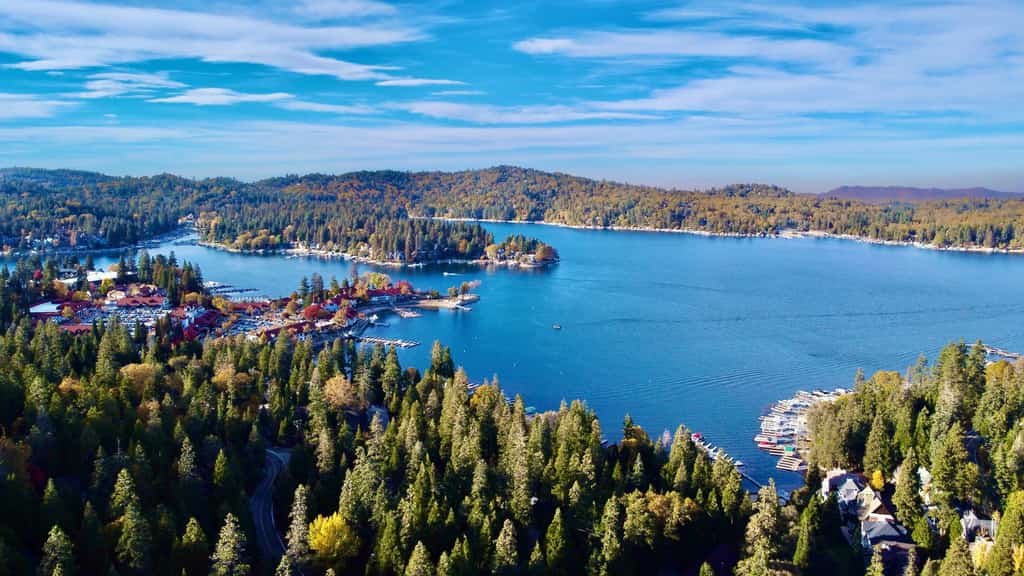 aerial view of lake arrowhead in california showing docks and boats and forest surrounding the lake