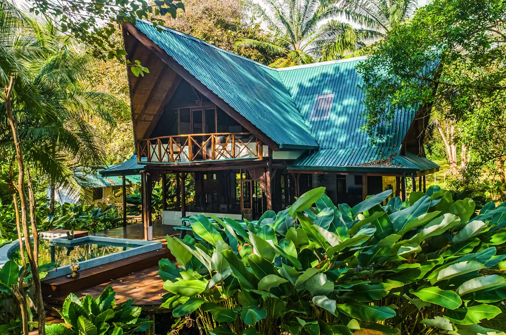 vacation home surrounded by lush green trees and plants in costa rica