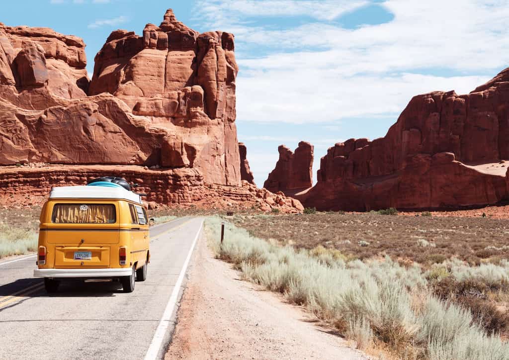 A van on vacation in a desert.