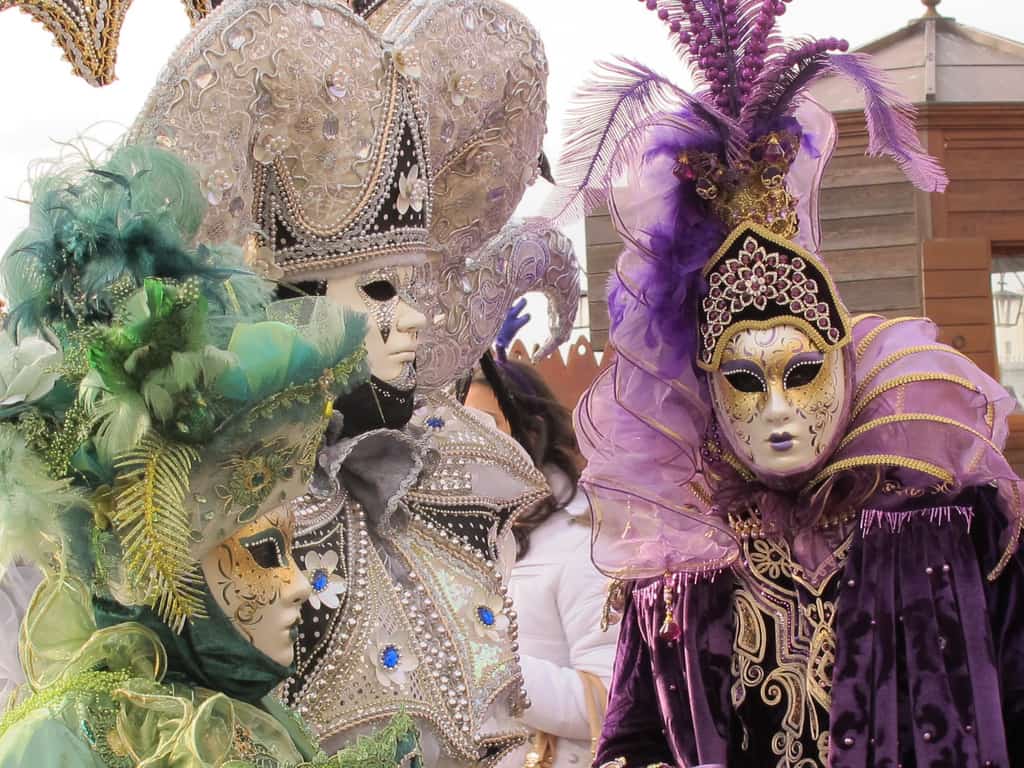 Image of people wearing masks at Mardi Gras