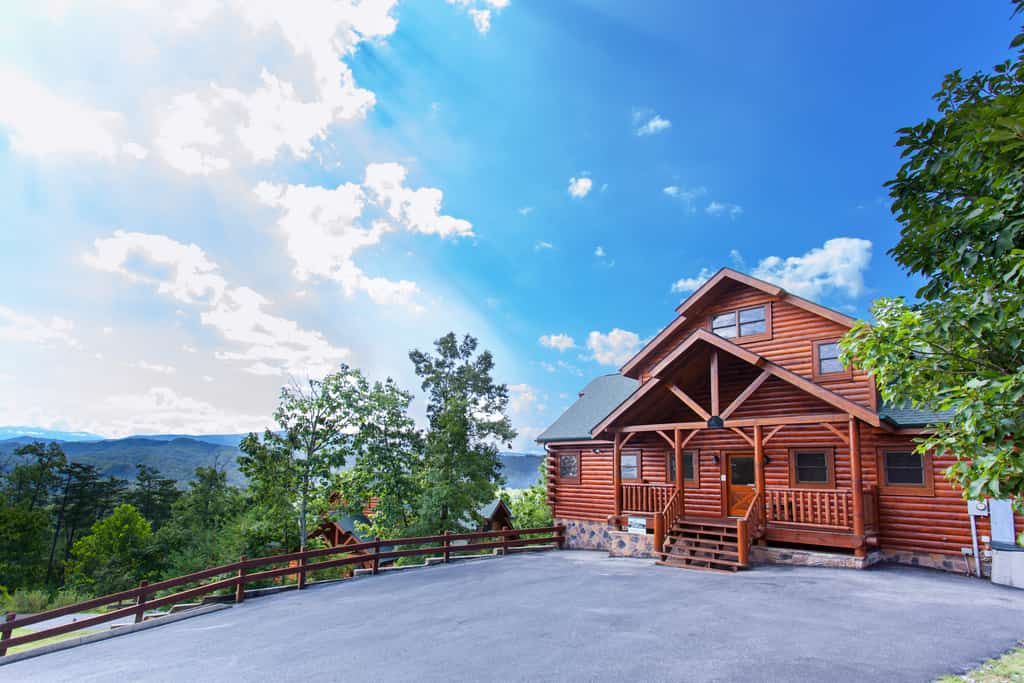 gorgeous blue skies over a cabin in gatlinburg, tn