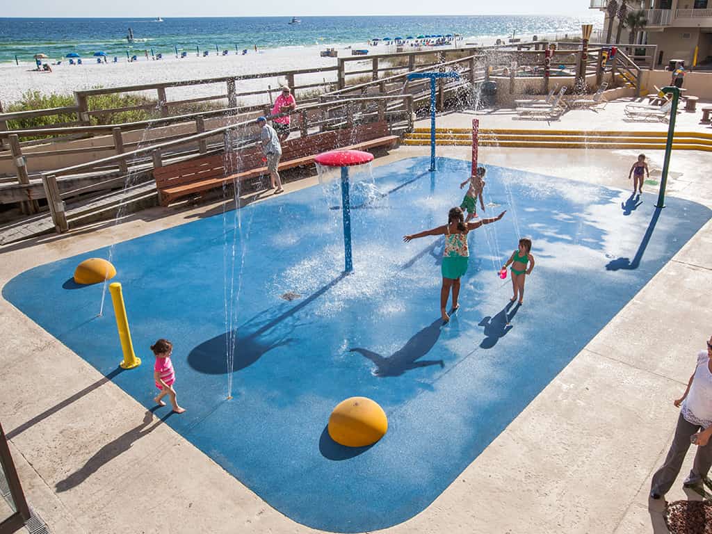 kids play in a small water park