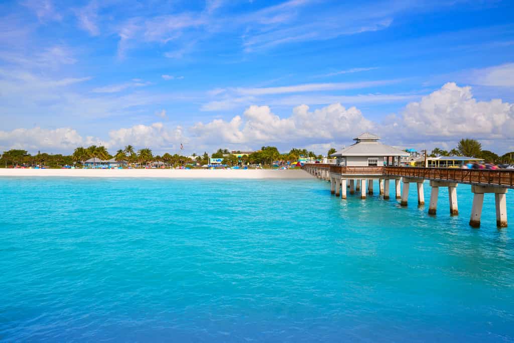 blue waters and a boardwalk by the beach in Fort Myers, Florida