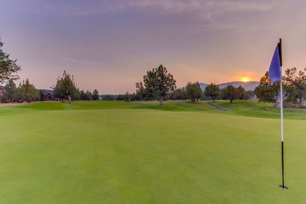Sun setting over golf course