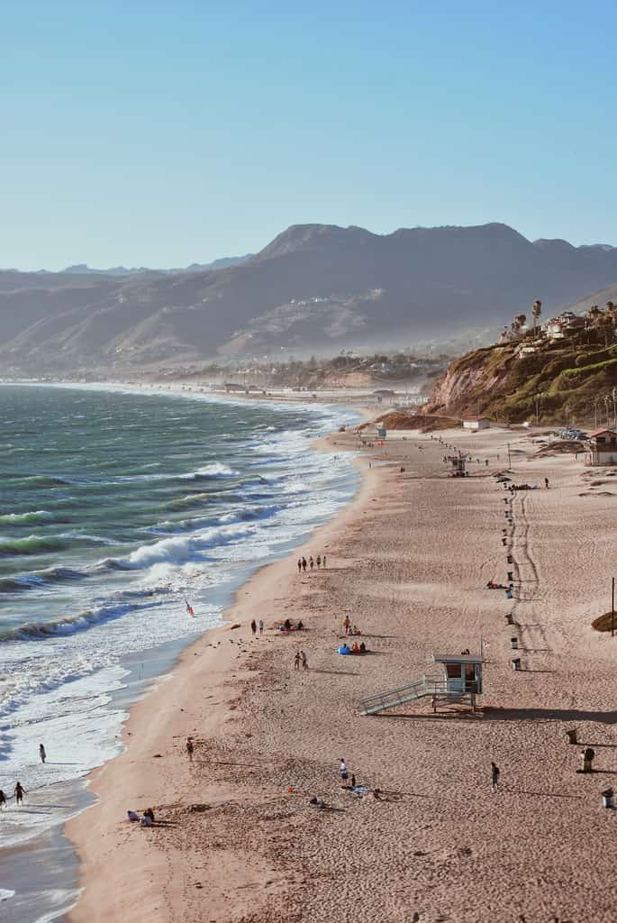 People on the shoreline during the day.