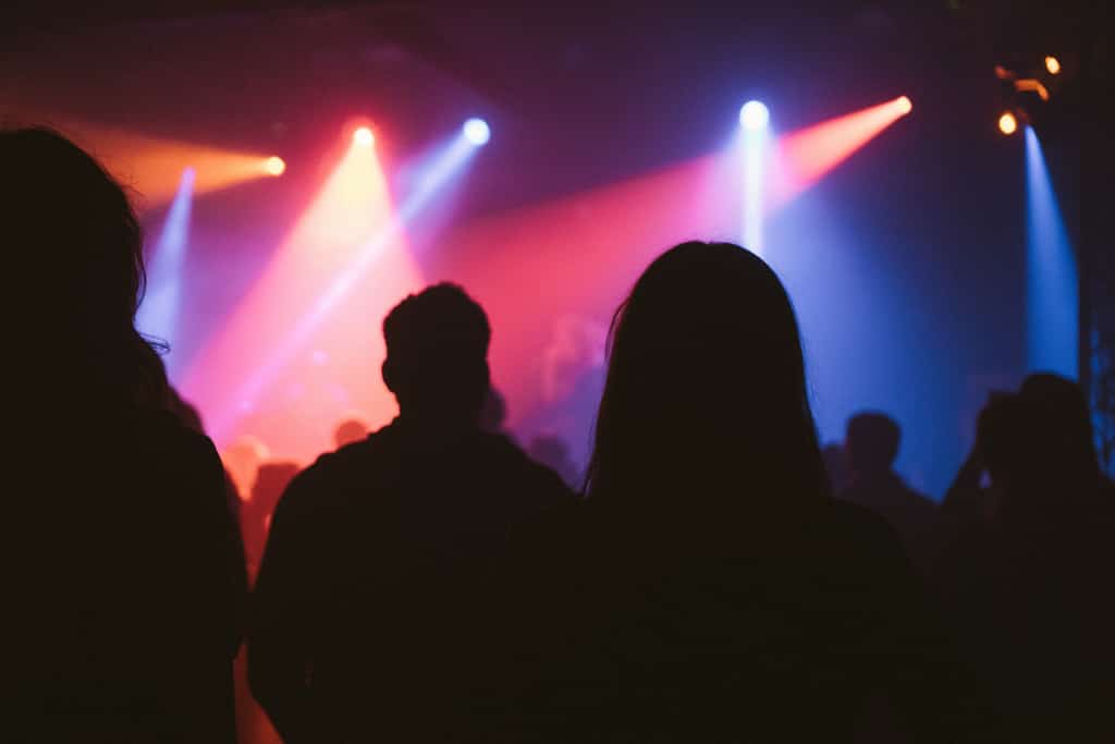 Silhouettes of festival-goers