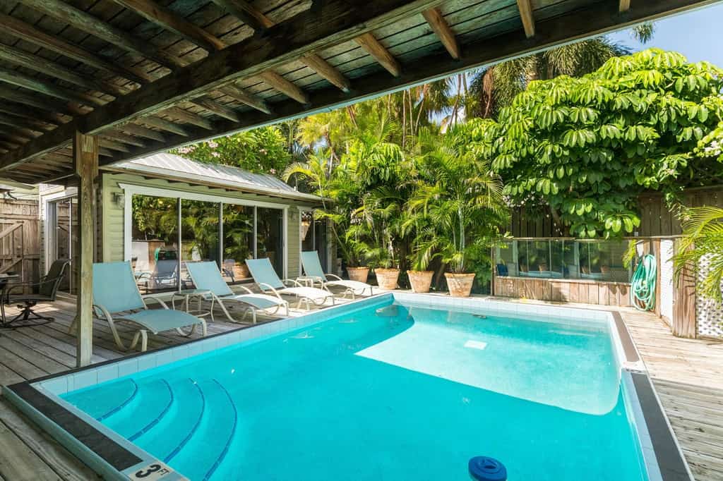 chairs by the pool at a key west vacation rental