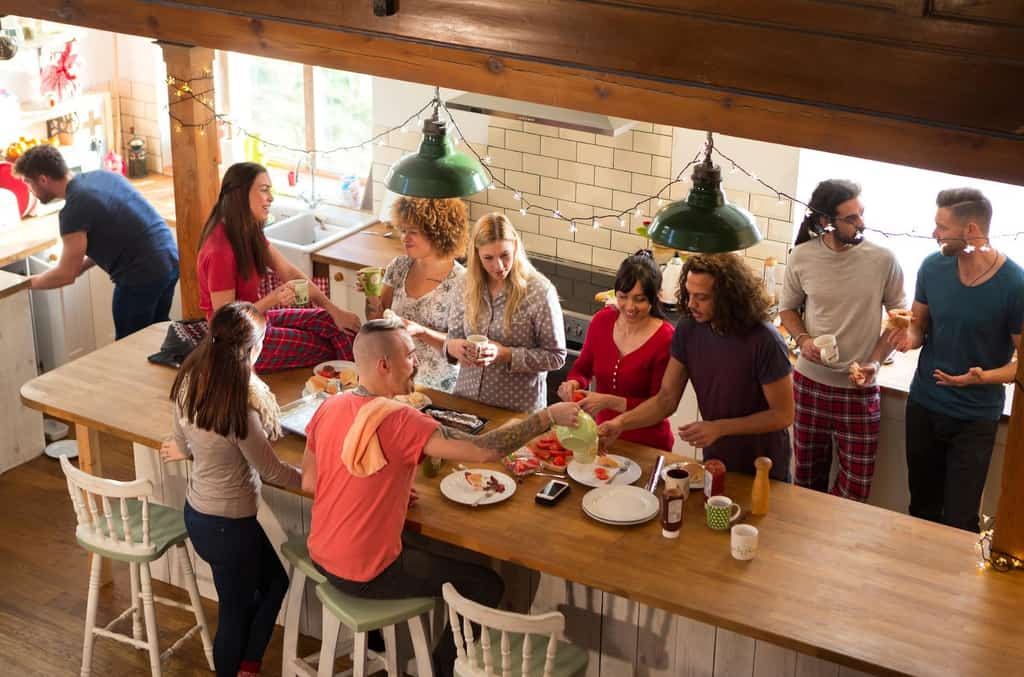 People serving food at a vacation rental.