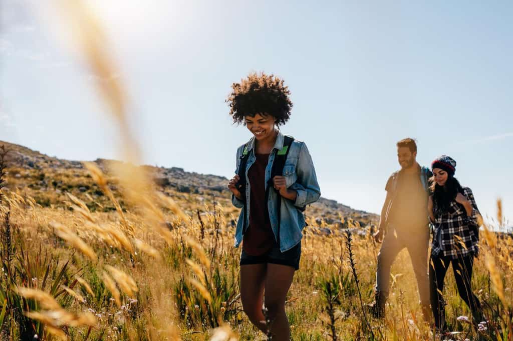 friends hiking in field