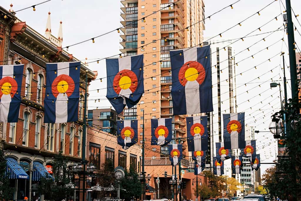 Downtown Denver, CO with state flags lined over the street.