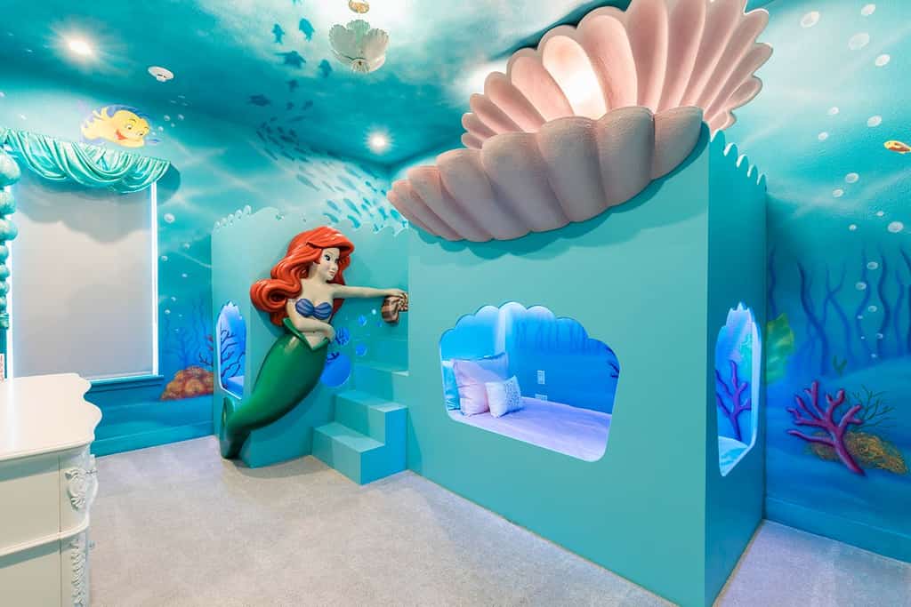 A kids room with a Little Mermaid theme at a vacation rental near Disney World in Florida.