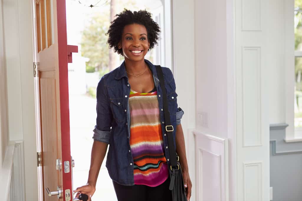 Woman walking into vacation home