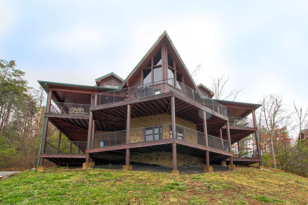 Massive floor-to-ceiling windows and a wraparound deck at this gorgeous Sevierville cabin