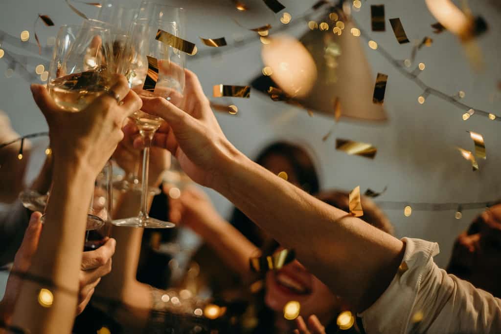 People holding glasses.