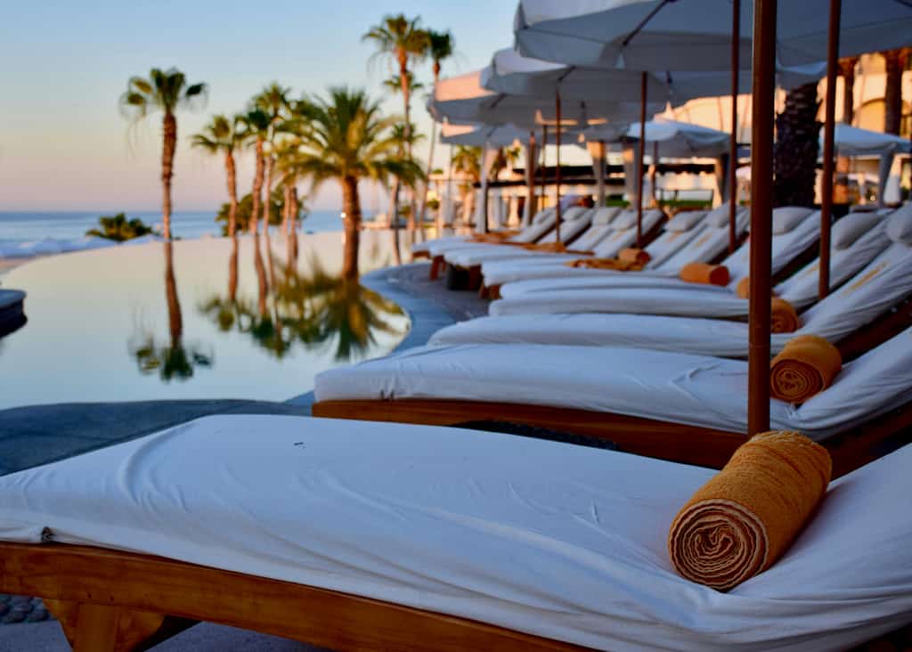 Beach towels and chairs on the beach.
