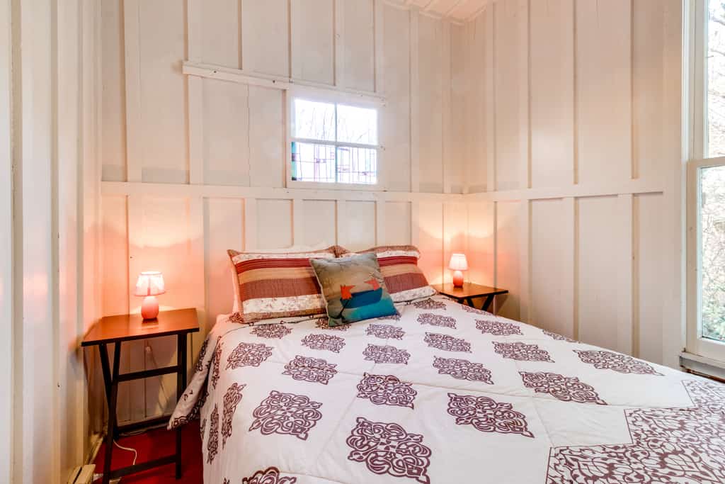 a made bed in a vacation home