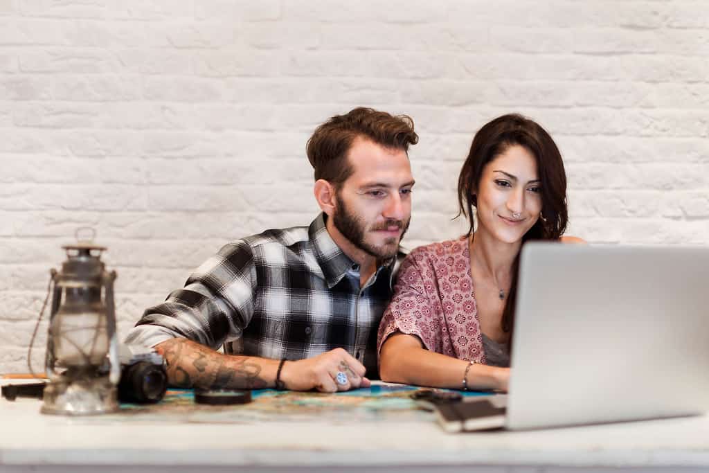 a couple viewing a laptop together