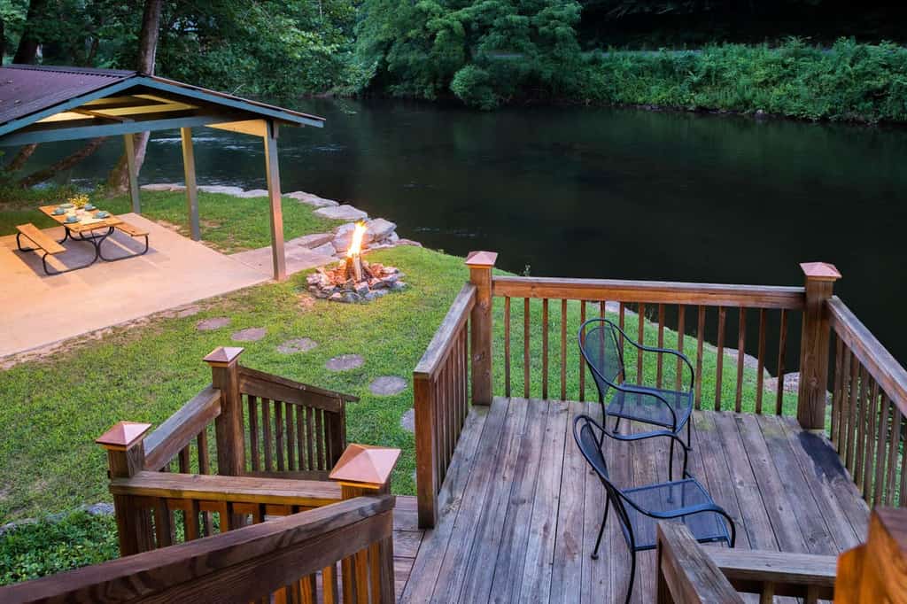 North Carolina riverfront cabin rental with outdoor seating and fire-pit