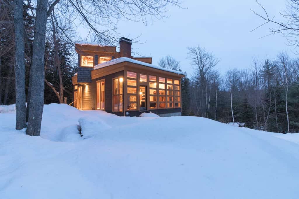Modern vacation cabin in the snowy woods of Vermont