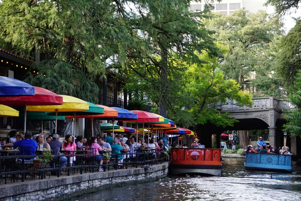 A canal with boats and restaurants in San Antonio, Texas.