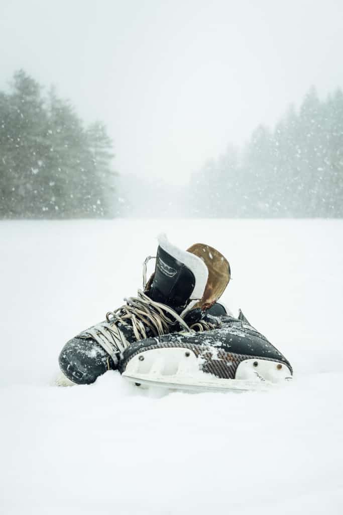 Ice skates in the snow.