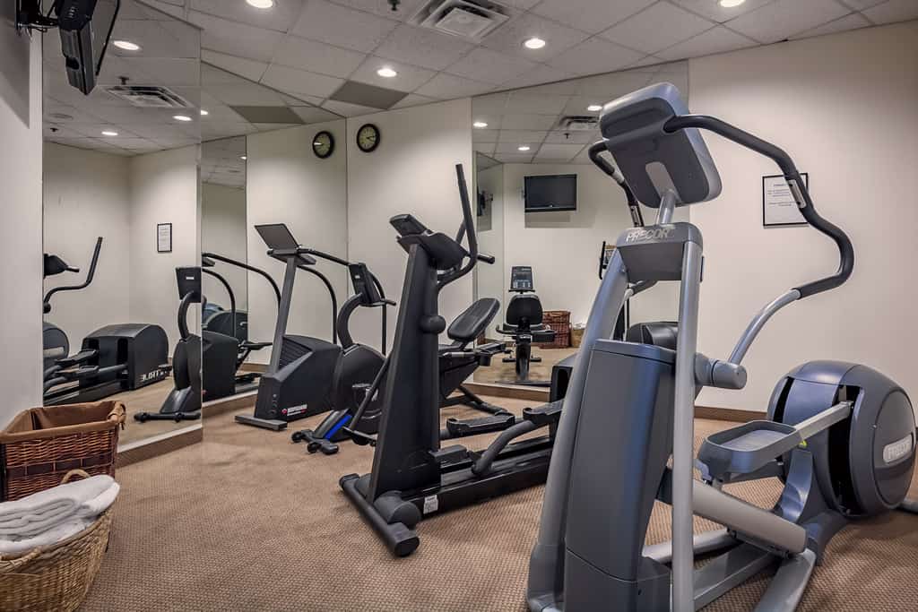 Work out equipment in a room with mirrors.
